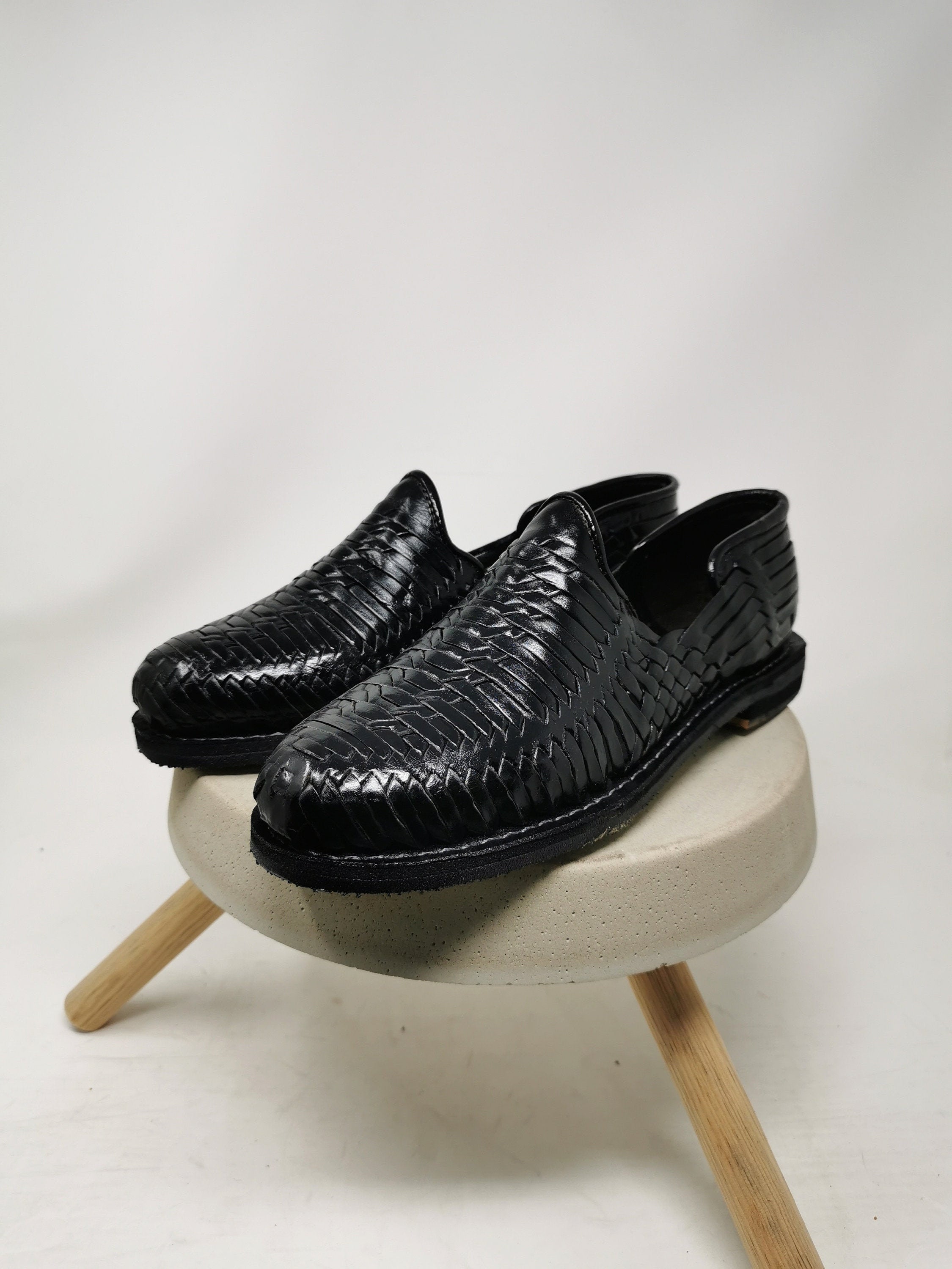 Men's black huarache sandal.