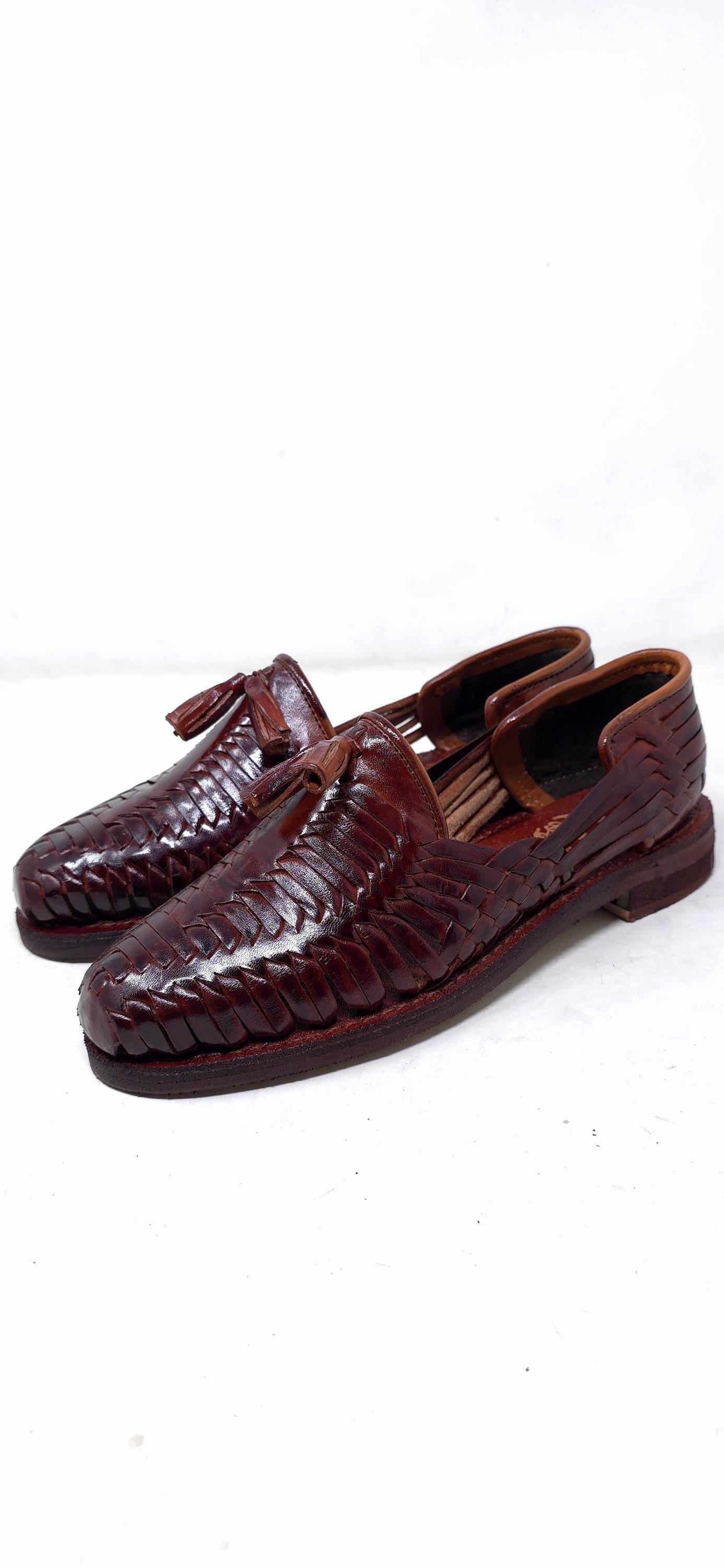 Artisan closed-toe leather huaraches with tassels