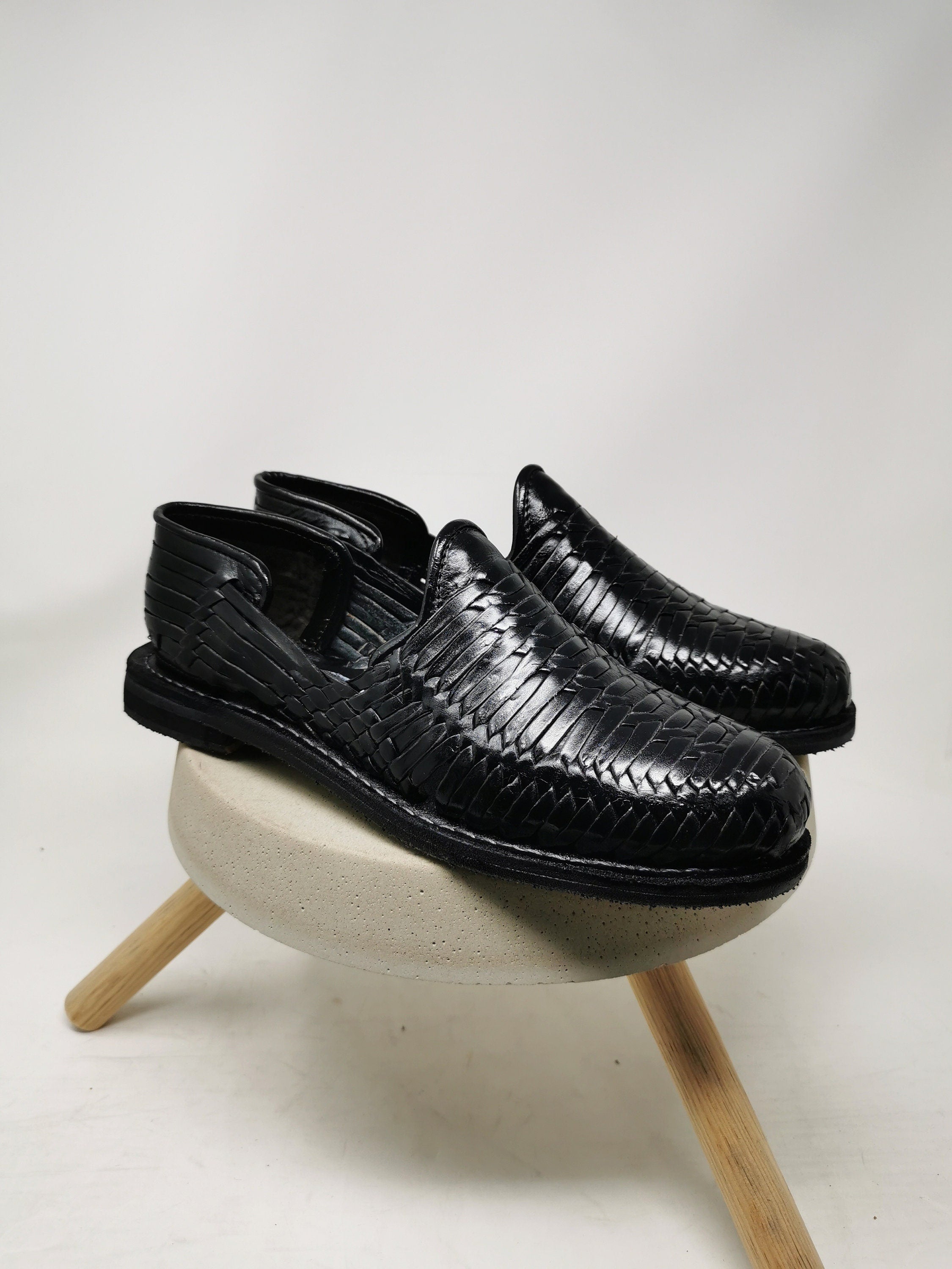 Men's black huarache sandal.