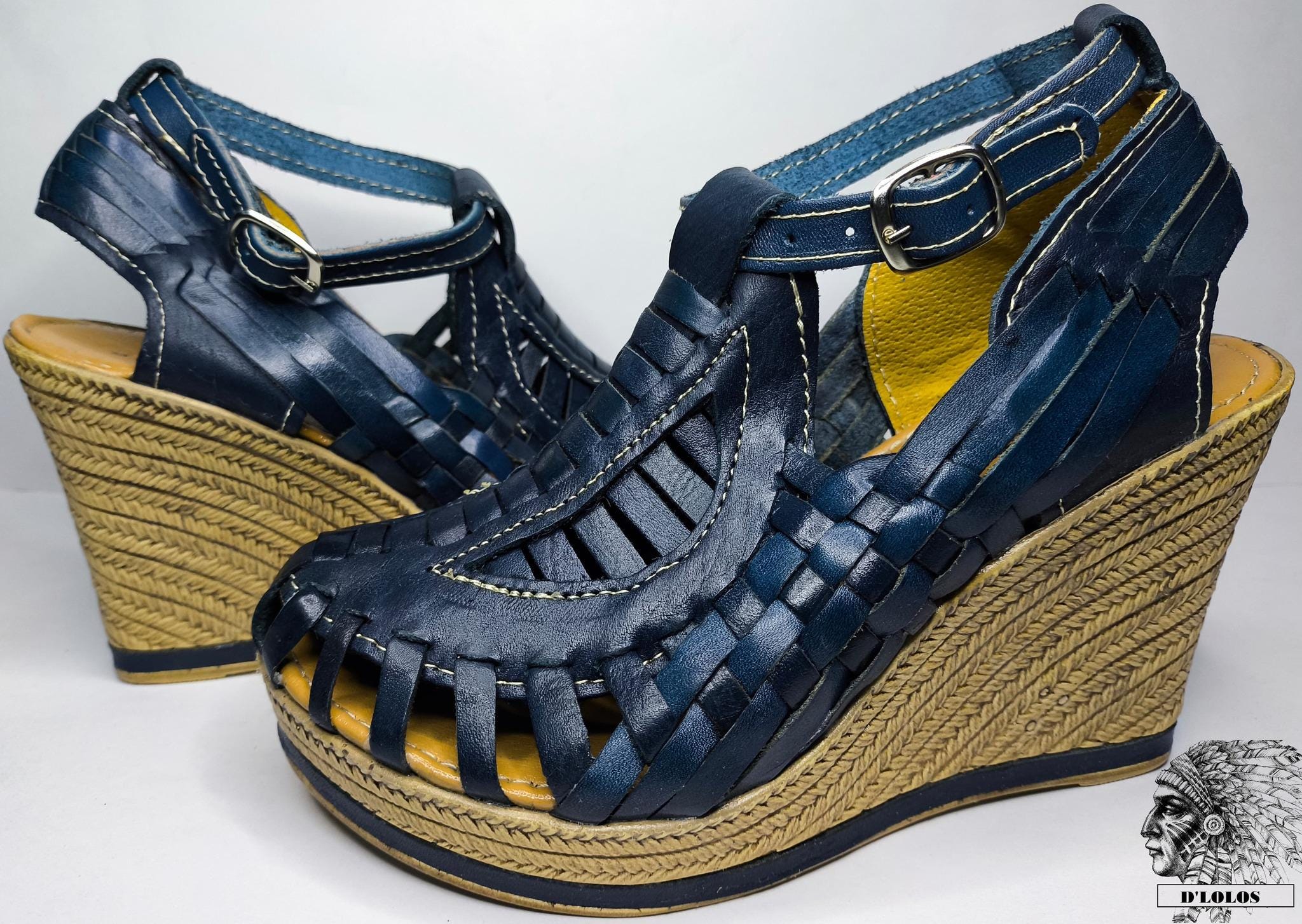 Women's closed-toe wedge huaraches with a high platform, the pair shown together on a plain background