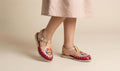 Baby and girls' sunflower-embroidered huaraches, side profile view of the little pair