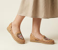 Women's embroidered floral huaraches, close-up of the flower embroidery