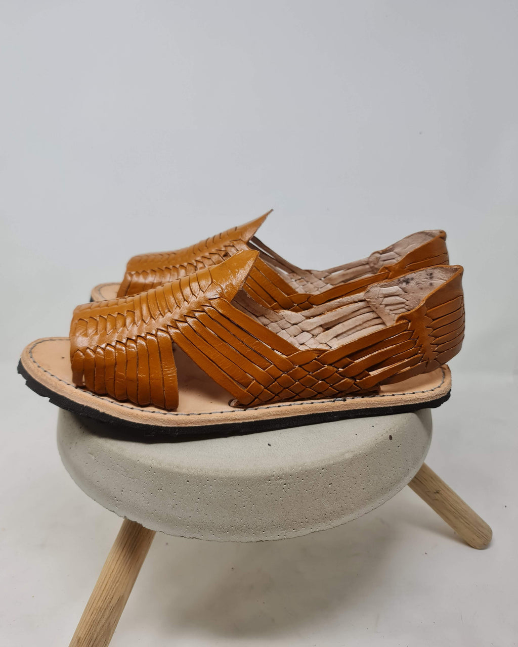 Men's honey brown leather huaraches seen from above, showing the natural vaqueta footbed