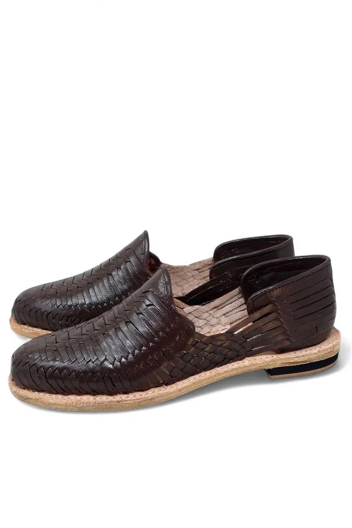 Women's dark brown huaraches showing the edge-stitched natural leather sole and low stacked heel with a black band