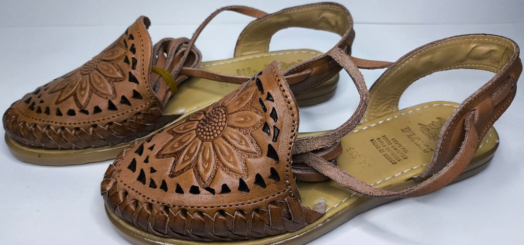 Side view of the brown Roman huaraches: hand-woven sides, cutouts, heel counter with loop and flat synthetic sole