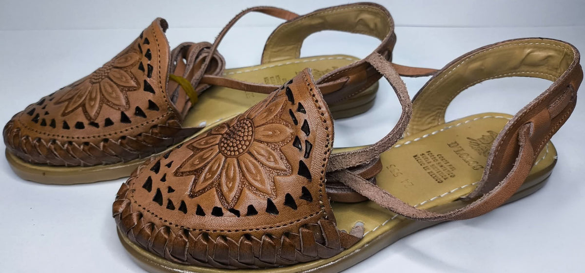 Side view of the brown Roman huaraches: hand-woven sides, cutouts, heel counter with loop and flat synthetic sole