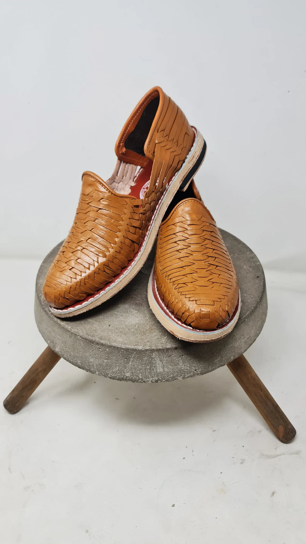 Detail of the ladder-style weave, covered heel and open sides of women's Satchel Tan huaraches