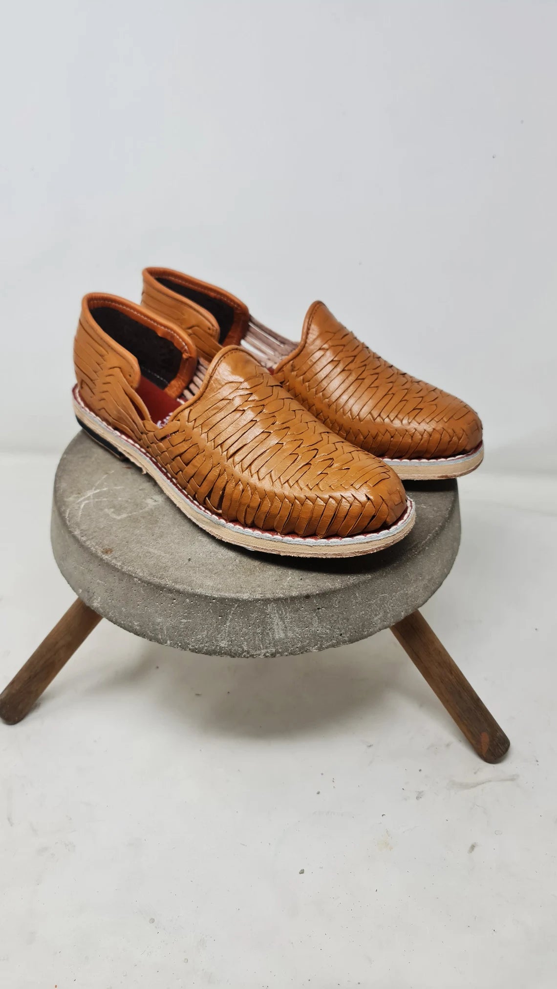 Women's Satchel Tan leather huarache sandals, three-quarter view of the closed toe and leather sole