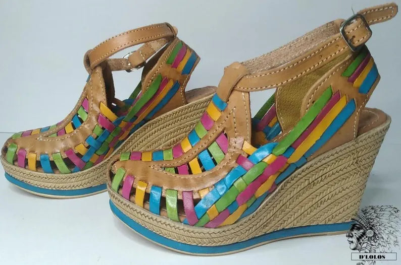 Women's closed-toe wedge huaraches with a high platform, showing the rich natural leather tone