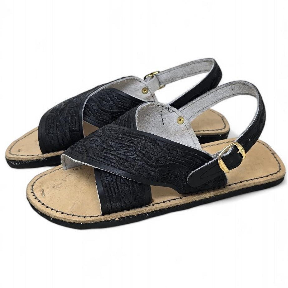 Black on black men's cross strap huarache sandals with tone-on-tone embroidery and a buckled back strap