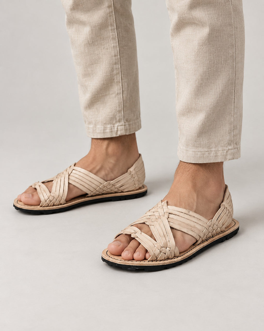 Men's open toe woven leather huarache sandals, natural leather, rubber sole, worn walking in linen pants